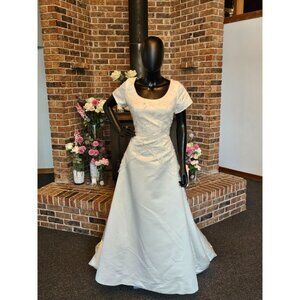 Joli Bridal Cap Sleeve Beaded Overlay Wedding Gown